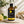 Load image into Gallery viewer, Citrom illóolaj 100 ml borostyánszínű üvegben elegáns üveg pipettával, friss citrommal és zöld levelekkel, világos természetes háttér előtt.
